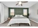 Guest bedroom with green accent wall and ceiling fan at 37762 N Poplar Rd, San Tan Valley, AZ 85140