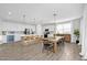 Modern kitchen with large island and dining table at 37762 N Poplar Rd, San Tan Valley, AZ 85140