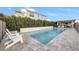 Relaxing pool area with stone patio and lush greenery at 37762 N Poplar Rd, San Tan Valley, AZ 85140