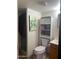 Clean bathroom with shower, toilet, and storage at 4043 E Arbor Ave, Mesa, AZ 85206