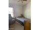 Bright bedroom with double bed and recliner at 4043 E Arbor Ave, Mesa, AZ 85206