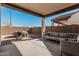 Covered patio with seating area and grill, perfect for outdoor entertaining at 42223 N Golden Trl, San Tan Valley, AZ 85140