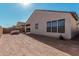 Backyard view of home with grassy area and block wall at 42223 N Golden Trl, San Tan Valley, AZ 85140