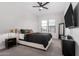 Well-lit bedroom with ceiling fan, TV and ample closet space at 42223 N Golden Trl, San Tan Valley, AZ 85140