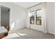 Bright bedroom with carpeted floor, large windows, and neutral walls at 42223 N Golden Trl, San Tan Valley, AZ 85140