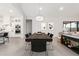 Modern dining room with a long wooden table and six black chairs at 42223 N Golden Trl, San Tan Valley, AZ 85140