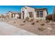 Modern single-story home with front yard landscaping and driveway at 42223 N Golden Trl, San Tan Valley, AZ 85140