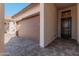 View of garage and entrance with brick pavers and a dark brown door at 42223 N Golden Trl, San Tan Valley, AZ 85140