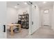 Home office with wood desk, black chair, and built-in shelving at 42223 N Golden Trl, San Tan Valley, AZ 85140