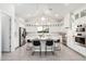 Modern kitchen with white cabinets, a large island, and stainless steel appliances at 42223 N Golden Trl, San Tan Valley, AZ 85140