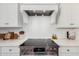 Modern kitchen with white cabinets, stainless steel appliances, and a white quartz countertop at 42223 N Golden Trl, San Tan Valley, AZ 85140