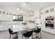 Modern kitchen with white cabinets, center island, and high ceilings at 42223 N Golden Trl, San Tan Valley, AZ 85140