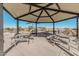 Covered picnic area with tables and benches, perfect for outdoor gatherings at 42223 N Golden Trl, San Tan Valley, AZ 85140