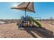 playground with shade structures, slides, and climbing toys at 42223 N Golden Trl, San Tan Valley, AZ 85140