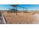 Community playground with swings and play structure at 42223 N Golden Trl, San Tan Valley, AZ 85140