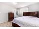 Bedroom featuring a double bed, dresser, and ceiling fan at 4405 W Clarendon Ave, Phoenix, AZ 85031