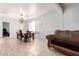 Dining area with table and chairs, adjacent to the living room at 4405 W Clarendon Ave, Phoenix, AZ 85031