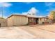 House exterior showcasing a large driveway and front yard at 4405 W Clarendon Ave, Phoenix, AZ 85031