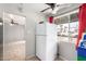 Kitchen area with white refrigerator and window at 4405 W Clarendon Ave, Phoenix, AZ 85031