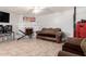 Living room with fireplace, tiled floors, and comfy seating at 4405 W Clarendon Ave, Phoenix, AZ 85031