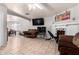 Open living space with a view into dining area and fireplace at 4405 W Clarendon Ave, Phoenix, AZ 85031