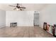 Spacious living room with tiled floors and a ceiling fan at 4405 W Clarendon Ave, Phoenix, AZ 85031