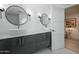 Modern bathroom with double vanity, large mirrors, and hexagon tile floor at 4432 E Camelback Rd # 120, Phoenix, AZ 85018