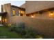 Landscaped exterior with lighting and stucco wall at 4432 E Camelback Rd # 120, Phoenix, AZ 85018