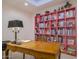 Home office with a pink shelving unit, wooden desk, and comfortable chair at 4432 E Camelback Rd # 120, Phoenix, AZ 85018