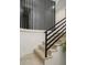 Modern staircase with black railings and light wood steps at 4432 E Camelback Rd # 120, Phoenix, AZ 85018