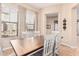 Bright dining room with wood table and white chairs, offering access to other rooms at 4777 S Fulton Ranch Blvd # 1027, Chandler, AZ 85248