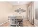 Bright dining room featuring a wood table and white chairs at 4777 S Fulton Ranch Blvd # 1027, Chandler, AZ 85248