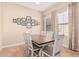 Bright dining room featuring a wood table and white chairs at 4777 S Fulton Ranch Blvd # 1027, Chandler, AZ 85248