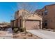 Tan two-story house with a brown garage door and tree at 4777 S Fulton Ranch Blvd # 1027, Chandler, AZ 85248