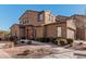 Two-story house with a wood door and landscaping at 4777 S Fulton Ranch Blvd # 1027, Chandler, AZ 85248