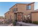 Two-story home with a stone facade and wood door at 4777 S Fulton Ranch Blvd # 1027, Chandler, AZ 85248