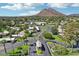 Beautiful aerial view of a desert community with mature landscaping and mountain backdrop on a sunny day at 4800 N 68Th N St # 228, Scottsdale, AZ 85251