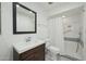 Well-lit bathroom featuring a modern vanity, toilet, and a tiled shower with a safety bar at 4800 N 68Th N St # 228, Scottsdale, AZ 85251