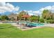 Refreshing community pool surrounded by manicured landscaping and lounge chairs at 4800 N 68Th N St # 228, Scottsdale, AZ 85251