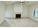 Spacious living room with a vaulted ceiling, fireplace, and tile flooring at 4800 N 68Th N St # 228, Scottsdale, AZ 85251