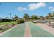 Well-maintained shuffleboard court with seating and landscaped surroundings at 4800 N 68Th N St # 228, Scottsdale, AZ 85251