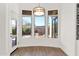 Charming breakfast nook with three windows and wood flooring at 4835 E Daley Ln, Phoenix, AZ 85054