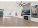 Spacious living room featuring hardwood floors, fireplace and large windows at 4835 E Daley Ln, Phoenix, AZ 85054