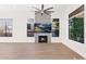 Bright living room with hardwood floors, fireplace, and large windows at 4835 E Daley Ln, Phoenix, AZ 85054