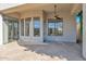 Covered patio with flagstone flooring and ceiling fan at 4835 E Daley Ln, Phoenix, AZ 85054