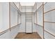 Spacious walk-in closet with ample shelving and hanging rods at 4835 E Daley Ln, Phoenix, AZ 85054