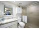 Bathroom with granite countertop, white cabinets, and shower at 4850 E Desert Cove Ave # 132, Scottsdale, AZ 85254