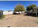 Simple backyard with a tree and gravel ground at 660 W 22Nd Ave, Apache Junction, AZ 85120