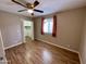 Bright bedroom with hardwood floors and ceiling fan at 660 W 22Nd Ave, Apache Junction, AZ 85120