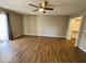 Bright bedroom with wood-look floors and access to a closet at 660 W 22Nd Ave, Apache Junction, AZ 85120